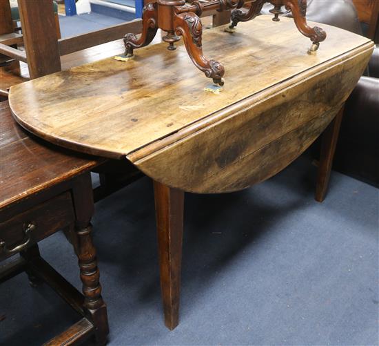 A late George III mahogany oval topped drop leaf dining table W.149cm